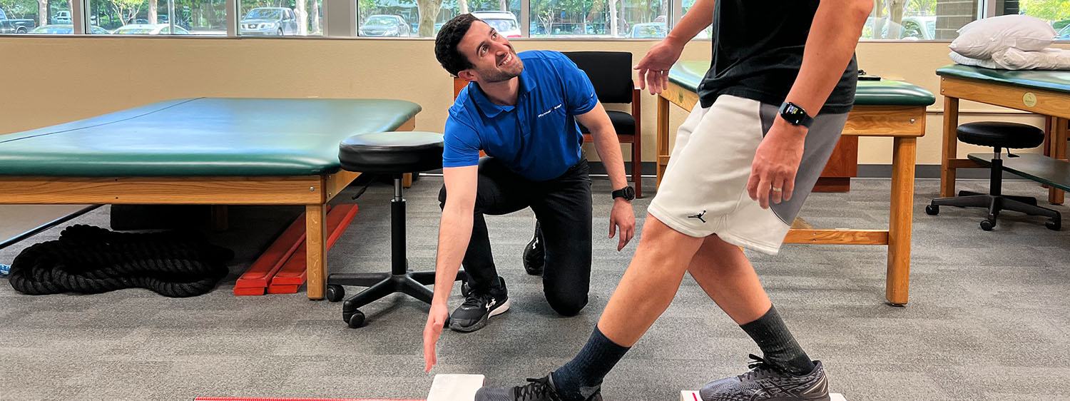 Physical therapist assisting patient during a therapy session